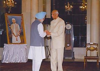 The Indian Prime Minister Manmohan Singh congratulating Sir CP Srivastava